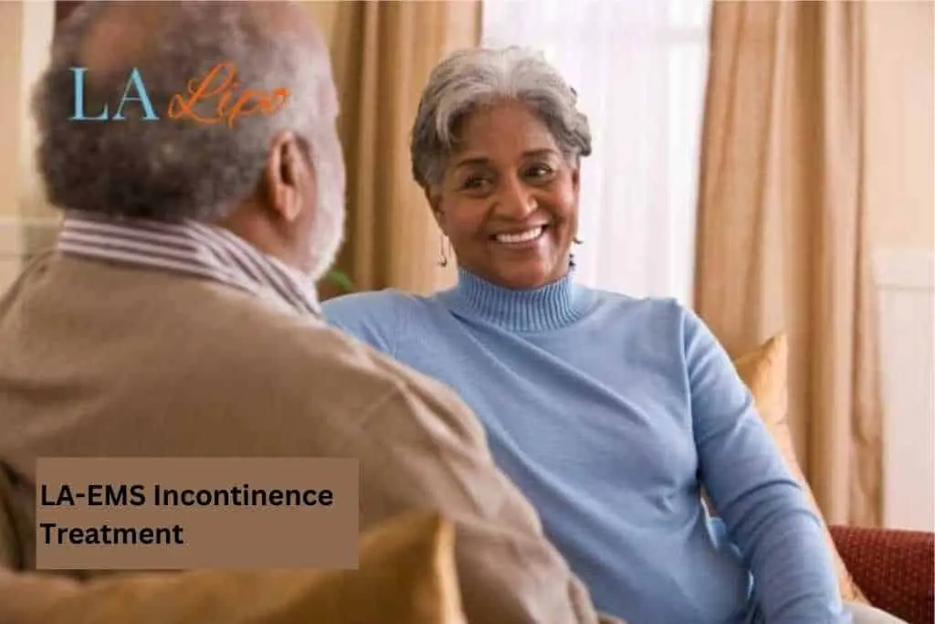 Couple sat smiling at each other - LA-EMS treatment Godalming