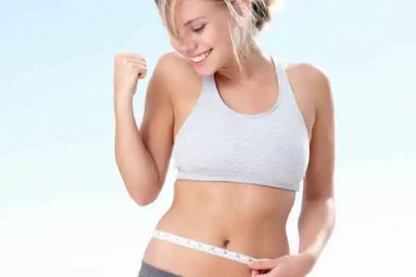 woman happy after fat reduction treatment Godalming