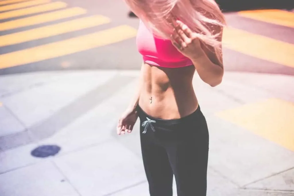 Woman with toned stomach after LA-EMS Body Sculpting Treatment Godalming