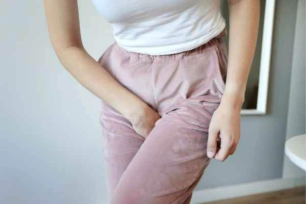 woman running for the toilet because of urinary incontinence Godalming